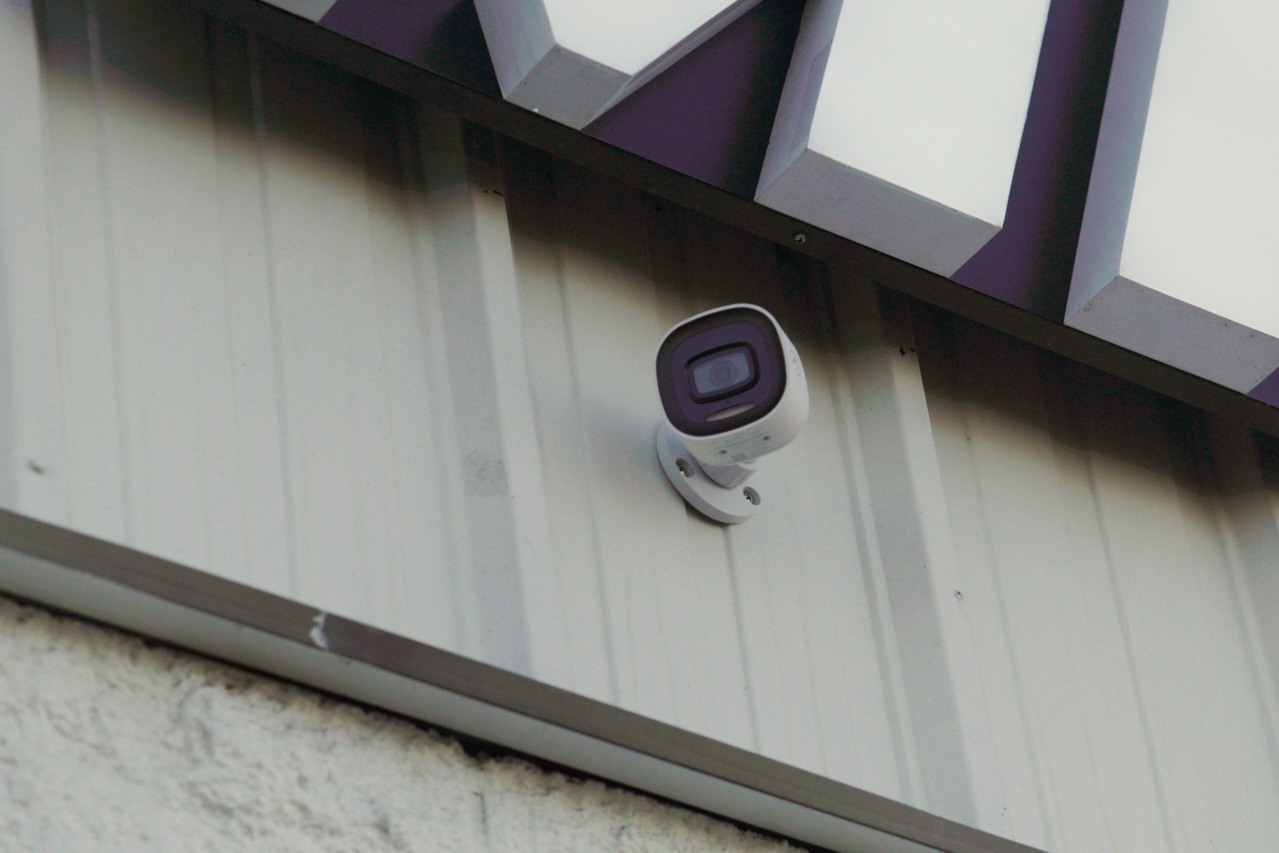 Security cameras installed under commercial LED sign